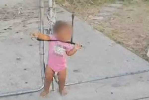 Screaming toddler found tied to wire fence with bungee cord around her neck